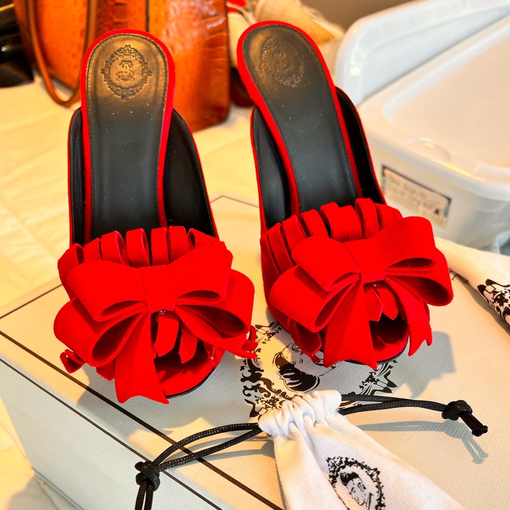 Aleksander Siradekian, red mules in excellent condition.